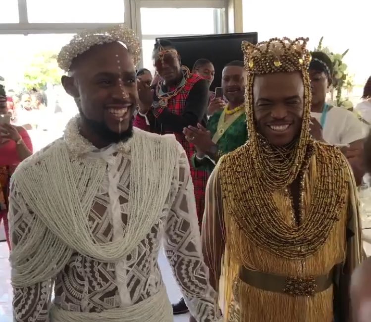 Somizi and Mohale walk in Wedding building