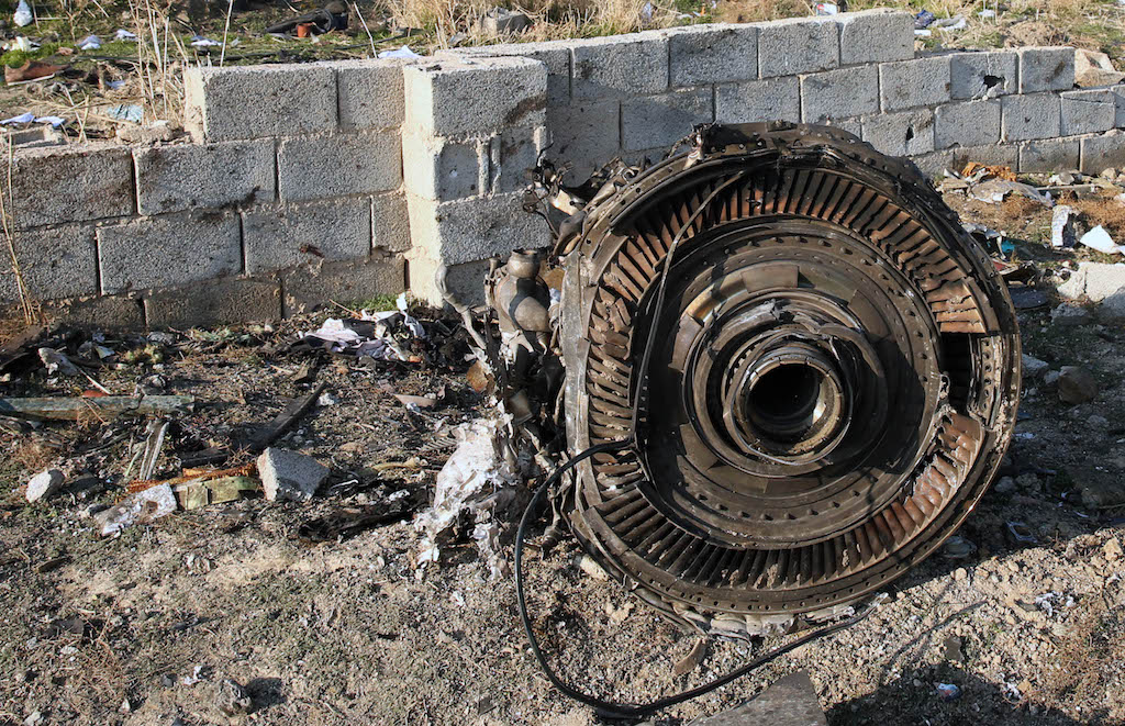 An engine lies on the ground after a Ukrainian plane carrying 176 passengers crashed near Imam Khomeini airport in the Iranian capital Tehran