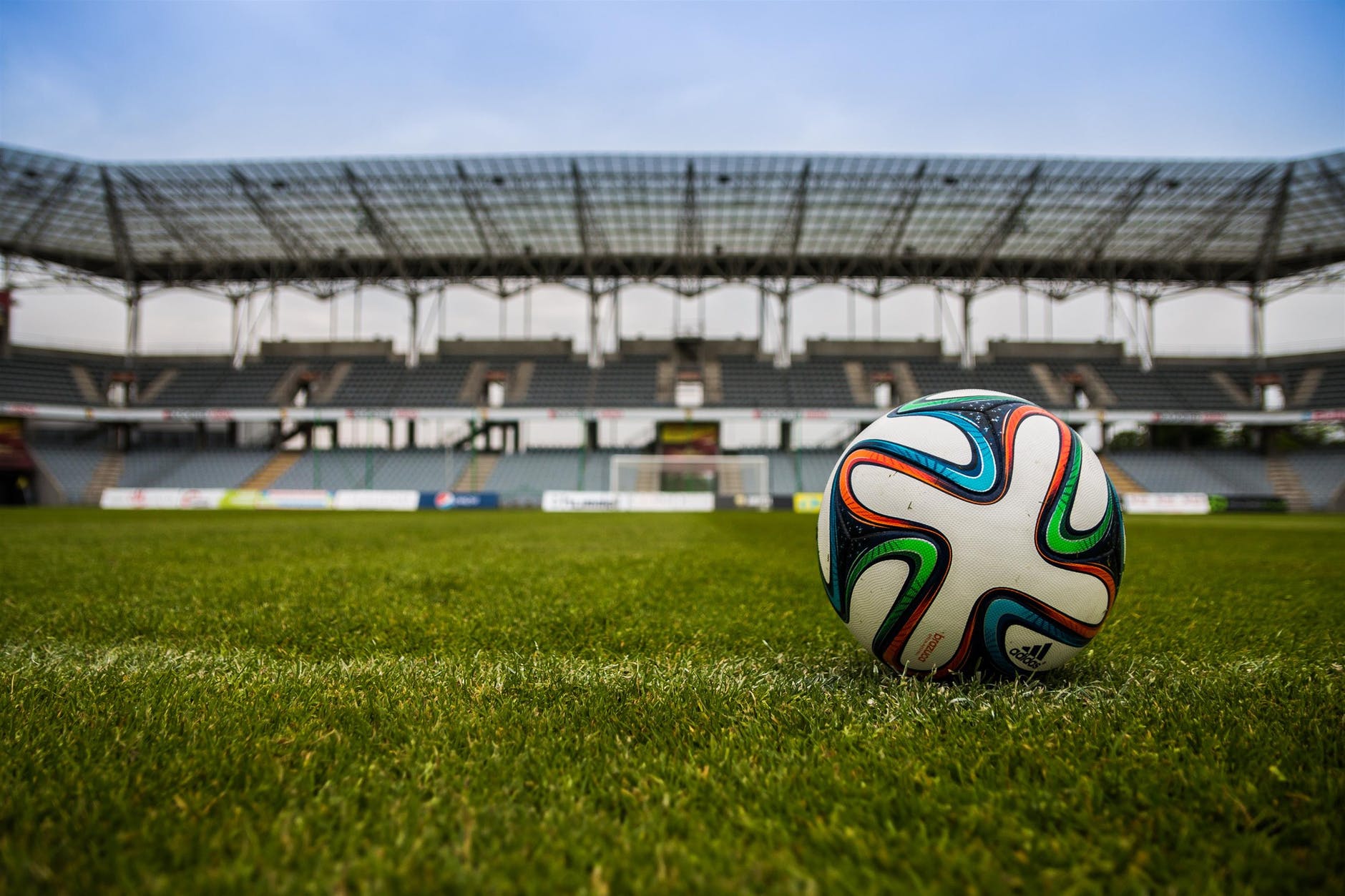 soccer ball on grass pitch