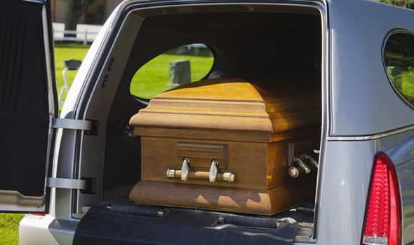 Hearse carrying coffin