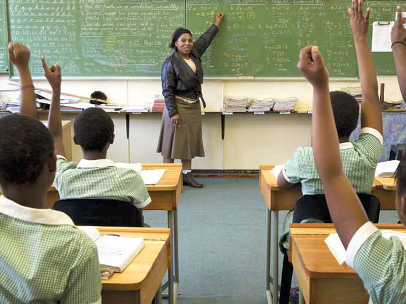 teacher in the classroom with pupils