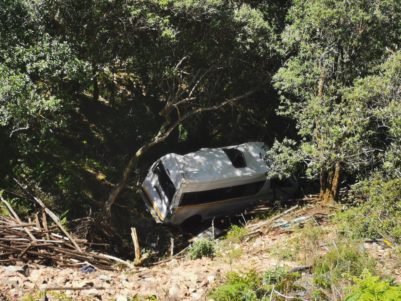 Taxi rolls down mountain side