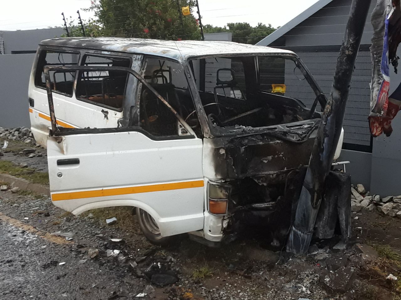 Taxi bursts into flames after hitting pedestrian and light pole