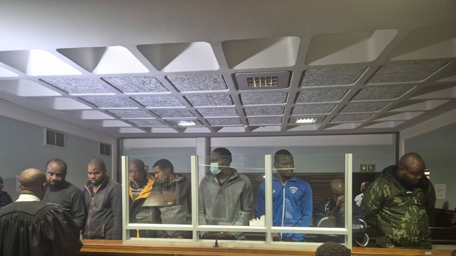 8 Nigerian men accused of attacking cops remain behind bars